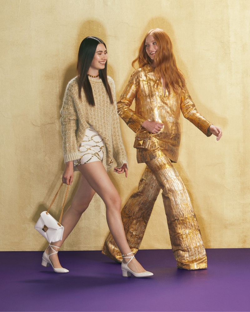 Models wear glittery metallics for The Valentino Party Collection 2022.