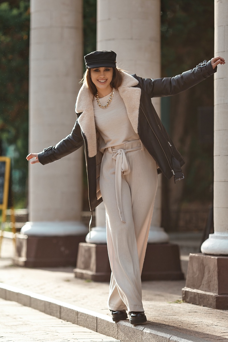 woman aviator jacket white pants street style