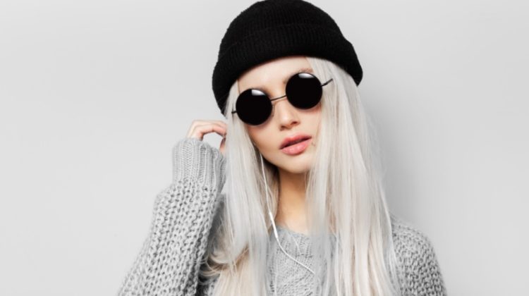 woman beanie round sunglasses gray sweater