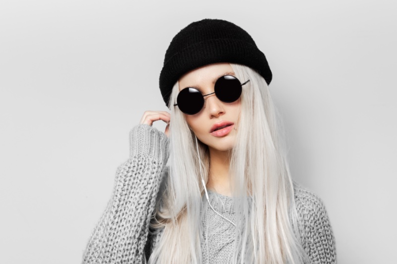 woman beanie round sunglasses gray sweater