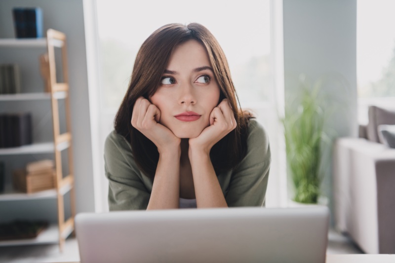 woman laptop thinking