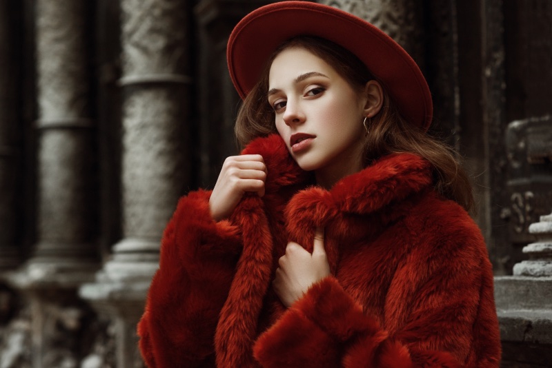 woman red faux fur coat hat