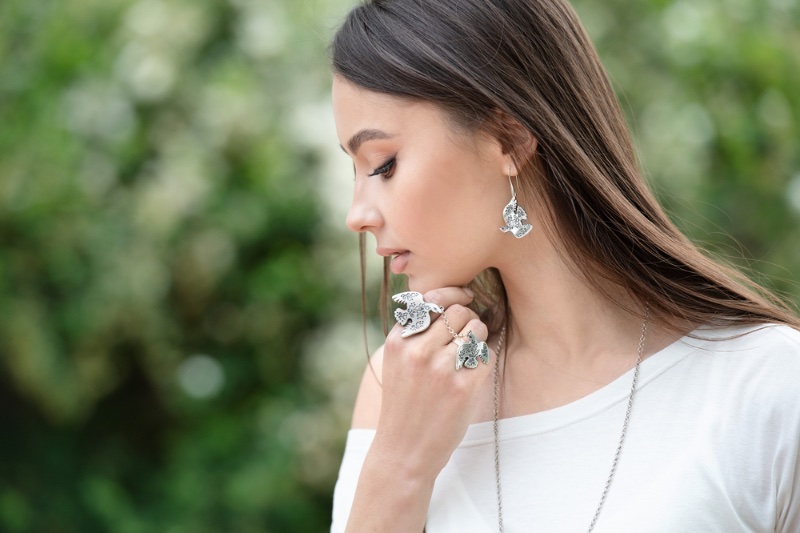 woman silver jewelry rings earrings