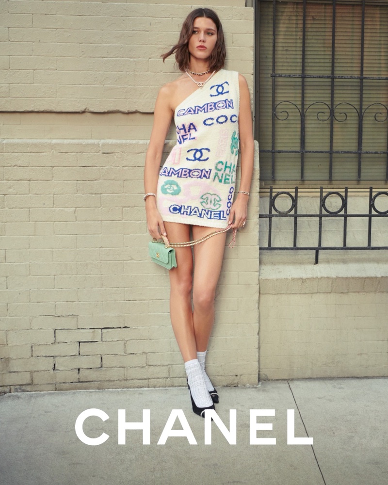 Chanel features one-shoulder logo print dress in pre-spring-summer 2023 collection.