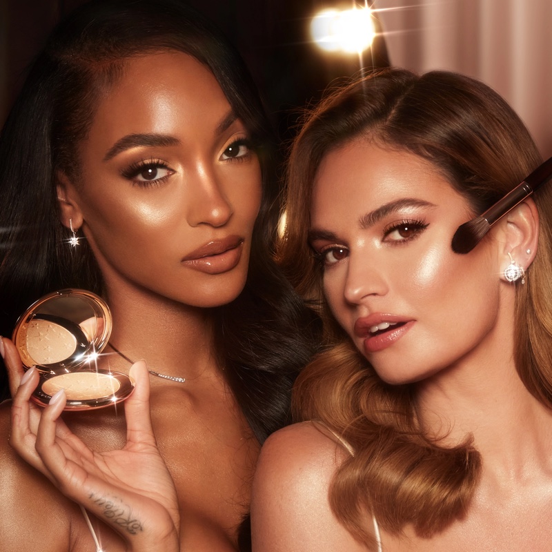 Charlotte Tilbury ambassadors Jourdan Dunn and Lily James front Hollywood Glow Glide Face Architect Highlighter campaign.