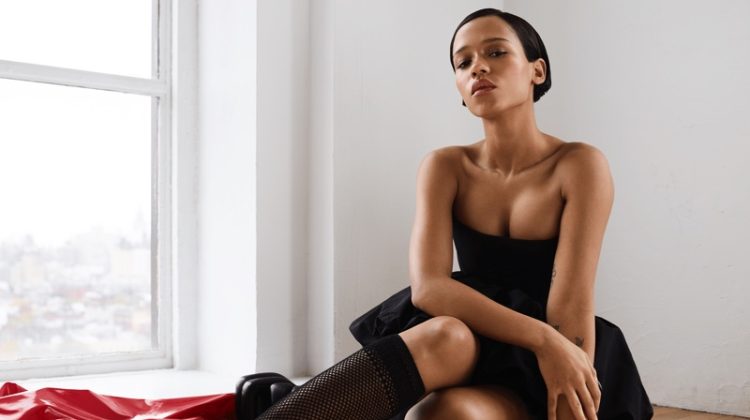 Dressed in black, Taylor Russell wears Dior dress and socks with Proenza Schouler platform shoes.