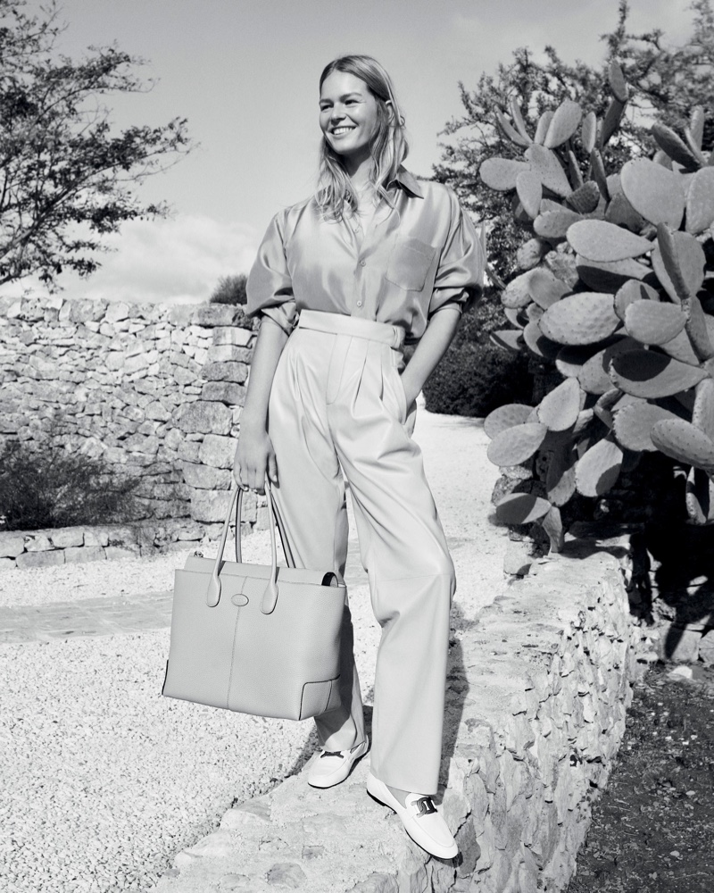 Posing in Italy, Anna Ewers fronts Tod's pre-spring 2023 campaign.