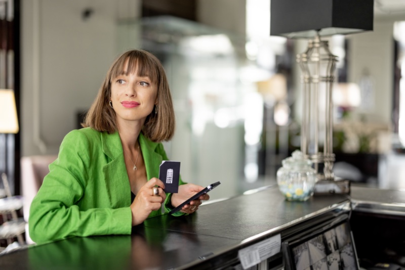 Woman Checking Into Hotel Fashion