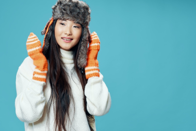 Asian Woman Orange Gloves Winter Hat Sweater