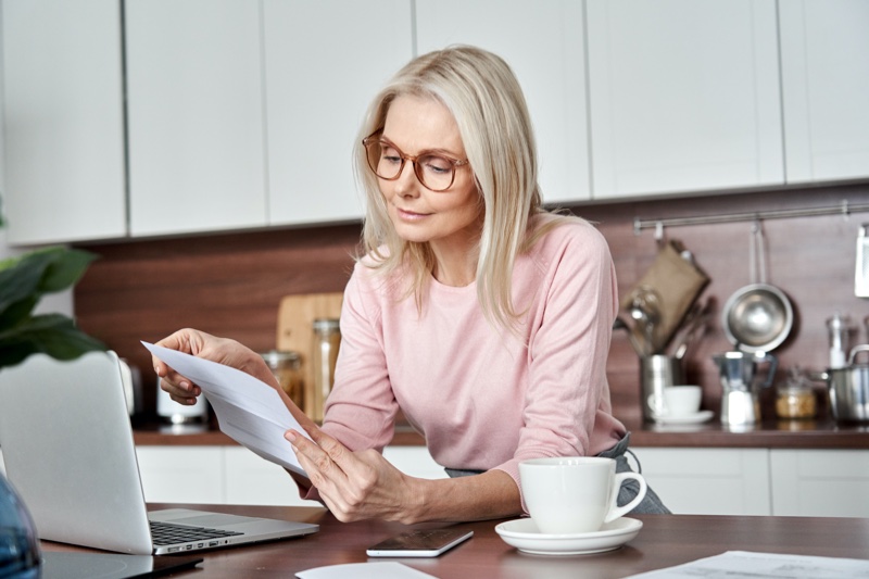 Older Woman Reviewing Insurance Papers