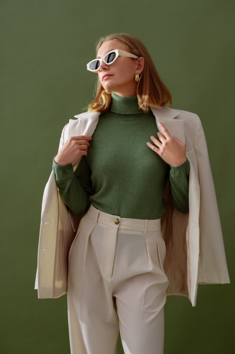 Pleated Trousers Woman Suit Jacket Turtleneck Sweater White Sunglasses