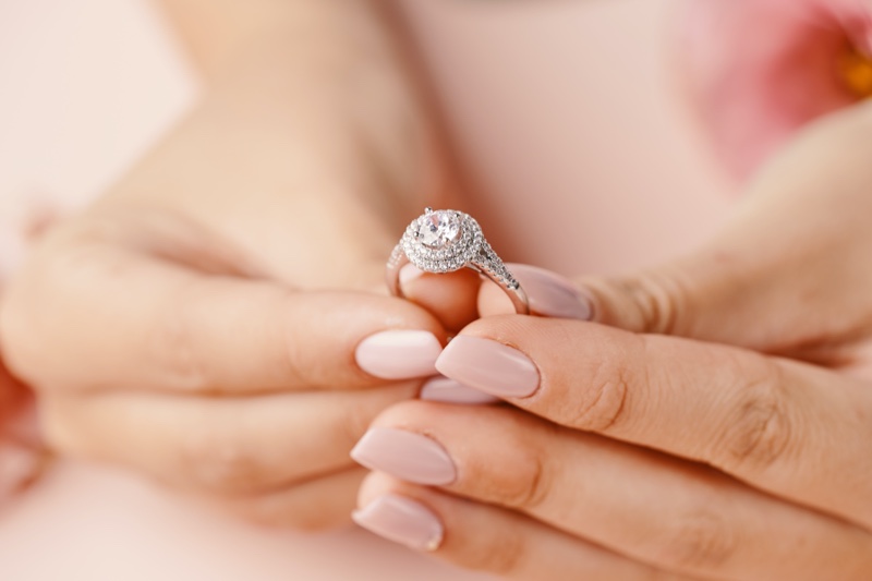 Woman Holding Ring Closeup