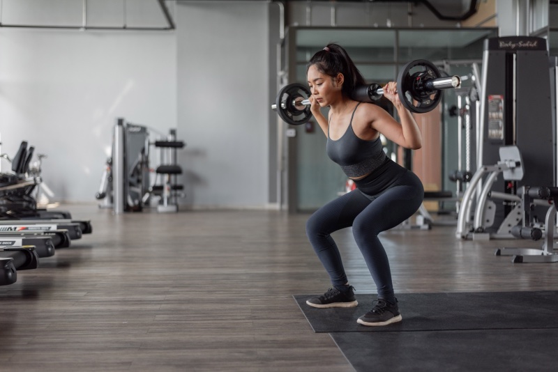 Woman Lifting Weights Strength Training