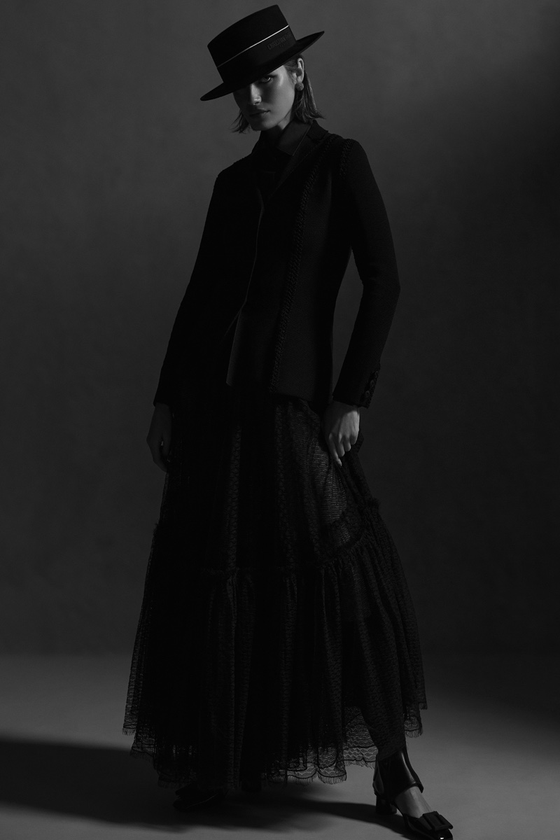 Bar Jacket in Black Technical Mesh, £3,500.00, Blouse in Black Cotton Poplin, £1,450.00, Flared Mid-Length Skirt in Black Plumetis Tulle, £3,600.00, Dior Epique Gaiter in Black Calfskin, £1,150.00, Dior Idylle Ballet Pump in Black Patent Calfskin and Grosgrain, £790.00, Diorodeo Small Brin Hat in Black Rabbit Felt, £800.00, All by Dior. Photo: Elizabeth Gibson