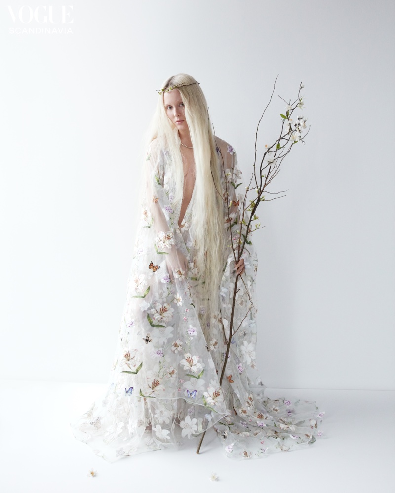 Draped in flowers, Zara Larsson channels Scandinavian folklore.