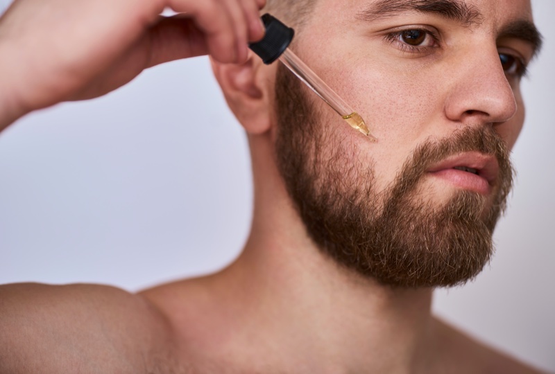 Man Using Beard Oil