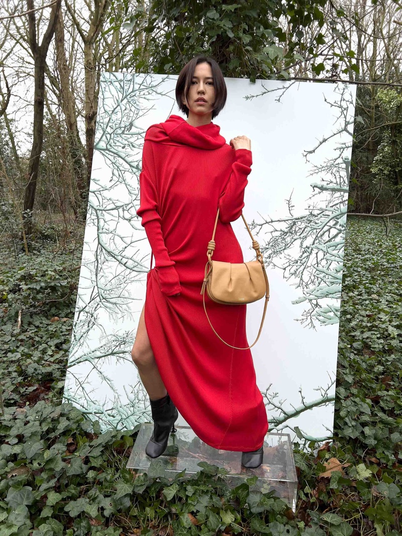 Sonoya Mizuno wears red dress in Loewe collection for pre-fall season.
