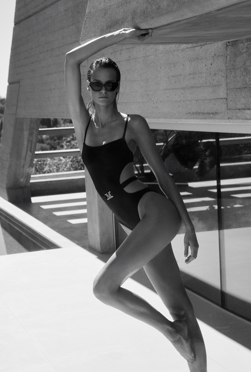 Effortless elegance by the shore: Mariina Keskitalo dons Max Mara's belted one-piece swimsuit with cut-out details.