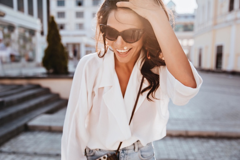 Woman Smiling White Blouse Cat Eye Sunglasses