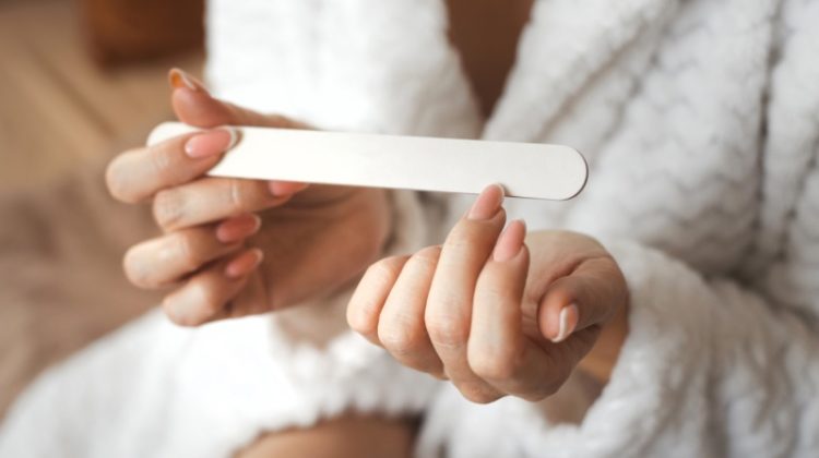 Woman Filing Nails