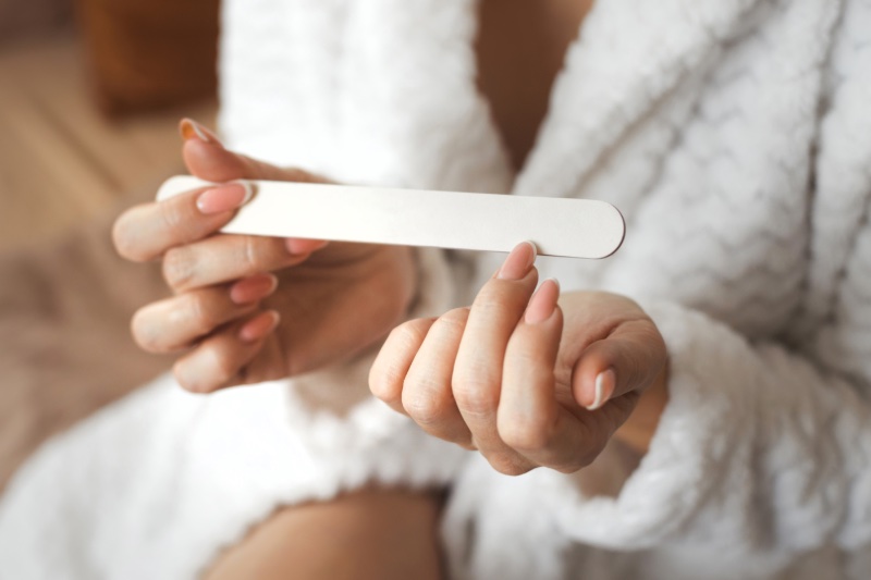 Woman Filing Nails