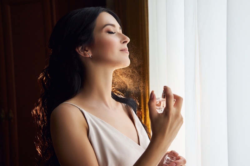 Woman Spraying Perfume