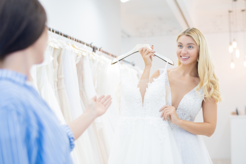Woman Trying on Wedding Dresses