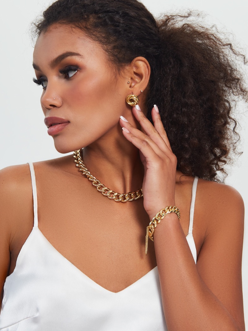 Woman Wearing Gold Jewelry