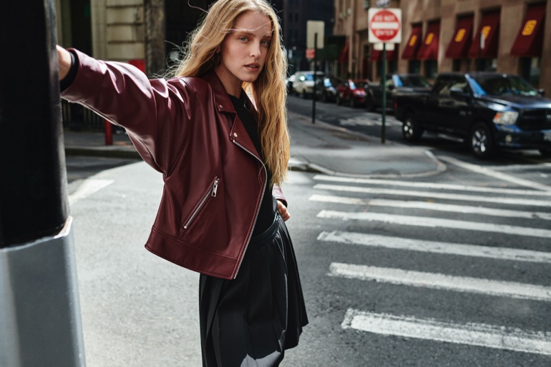 Abby Champion wears a leather jacket in DKNY fall-winter 2023 campaign.