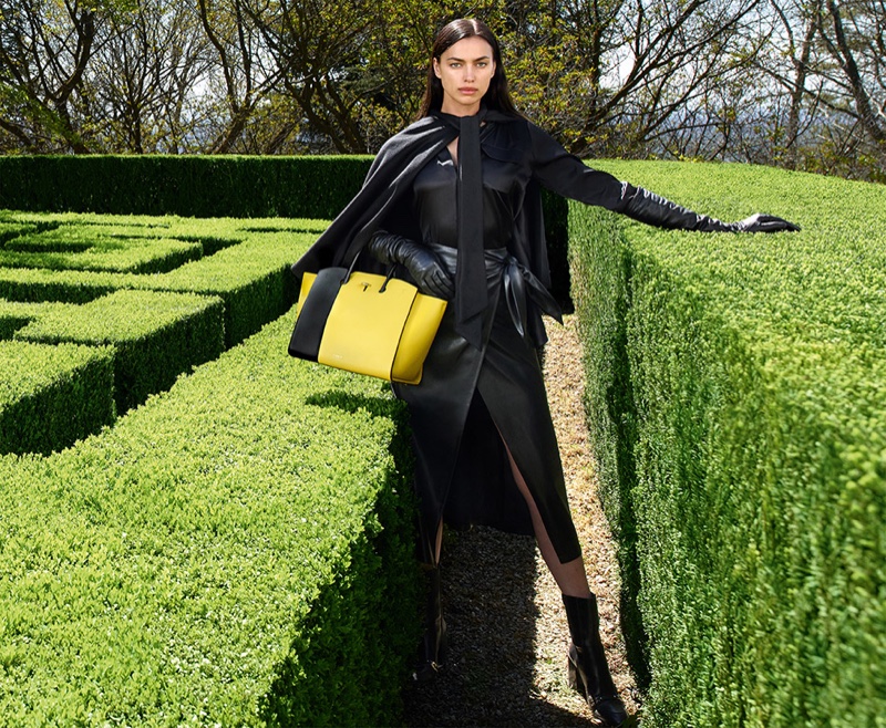 Furla's fall-winter 2023 campaign is set in a lush garden.