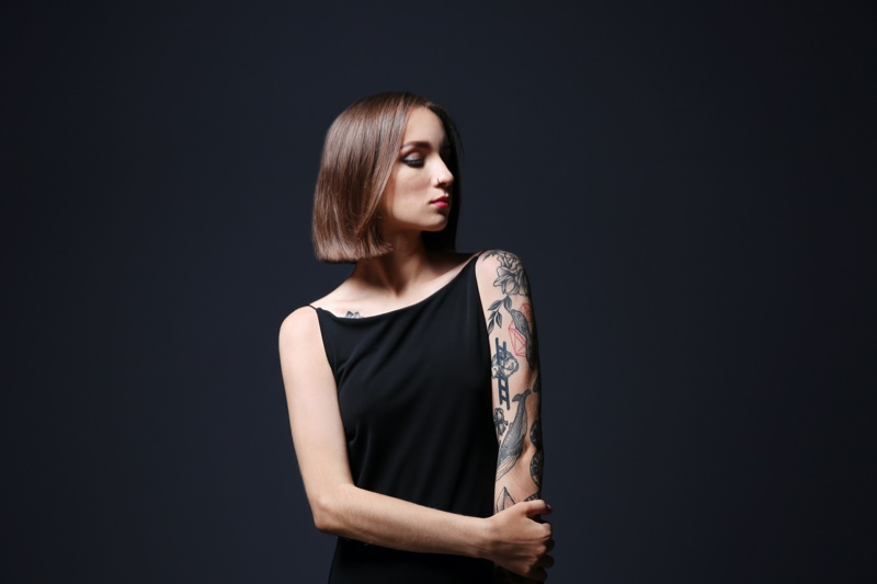 Woman Arm Tattoo Studio