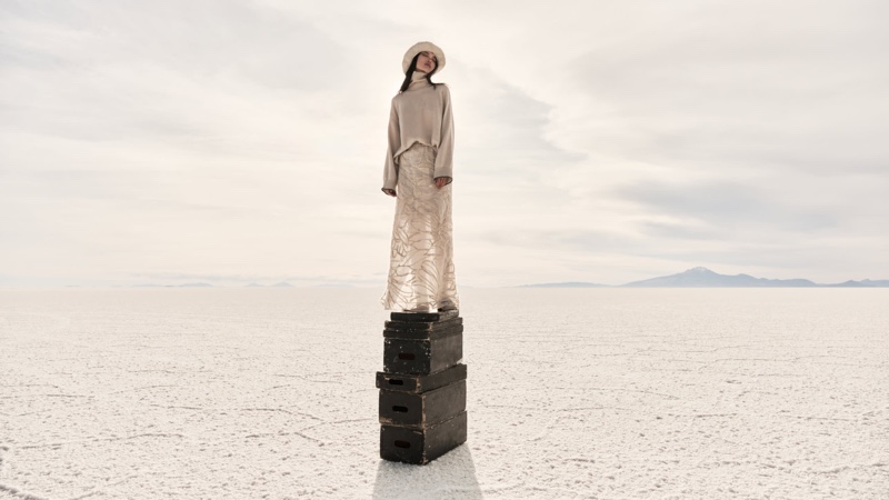 A turtleneck sweater and sheer skirt stand out in Brunello Cucinelli's fall 2023 campaign.
