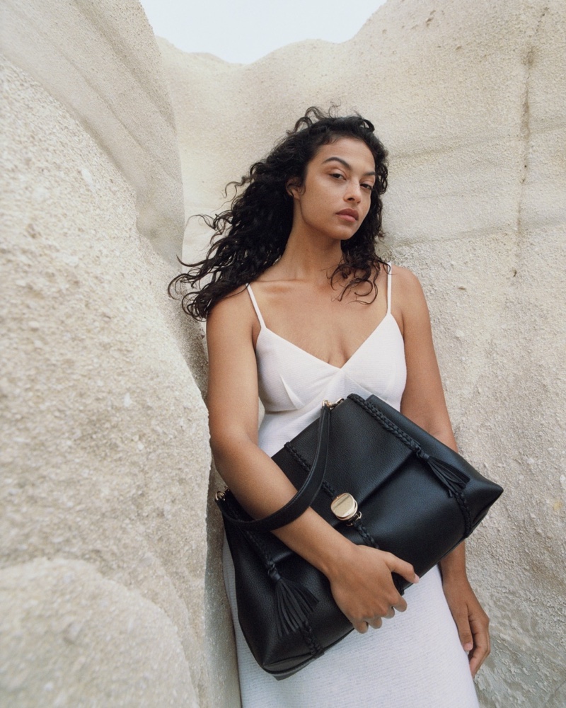 Devyn Garcia poses with the Penelope bag for Chloé's fall-winter 2023 campaign.
