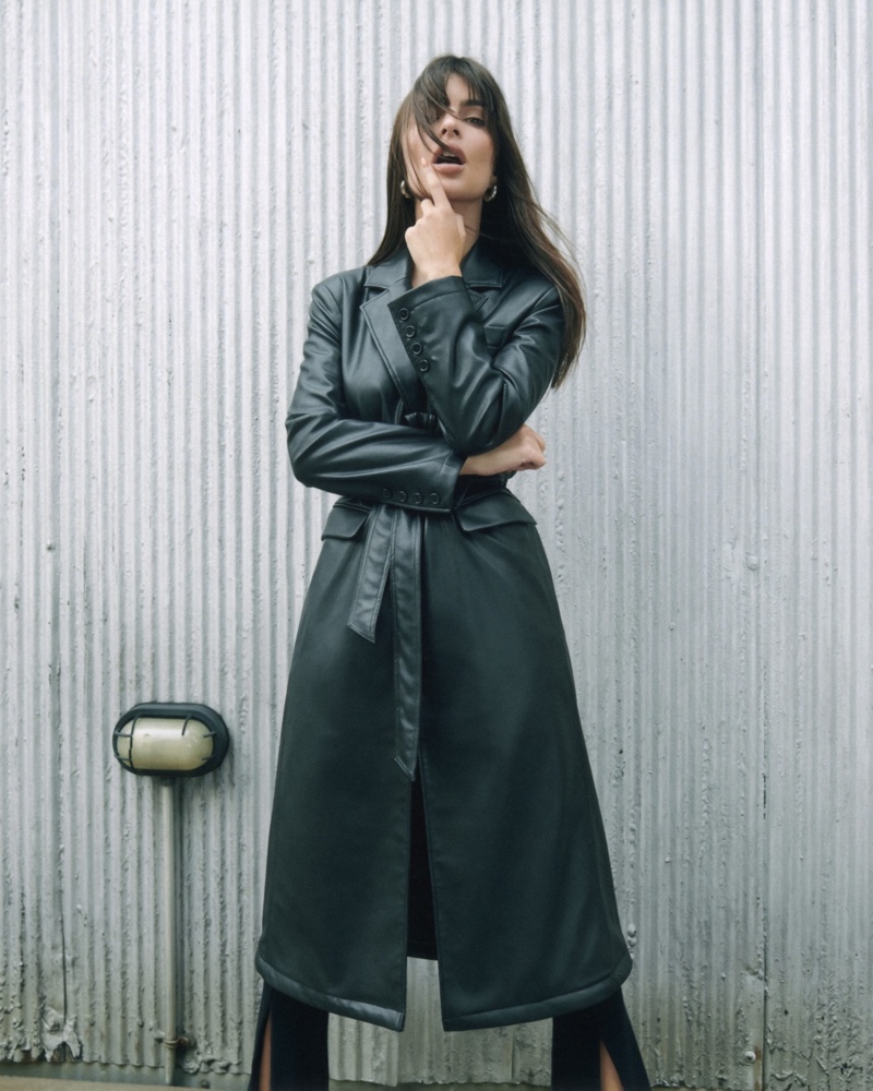 Emily Ratajkowski showcases vegan leather coat from EmRata x AG Jeans collection.