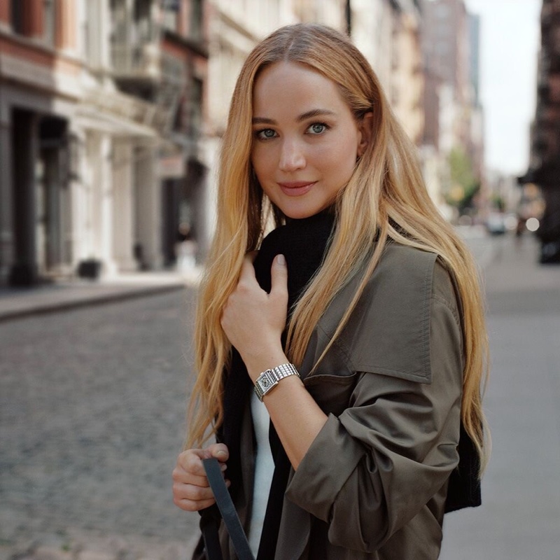 Posing on city streets, actress Jennifer Lawrence wears Longines Mini Dolcevita watch.