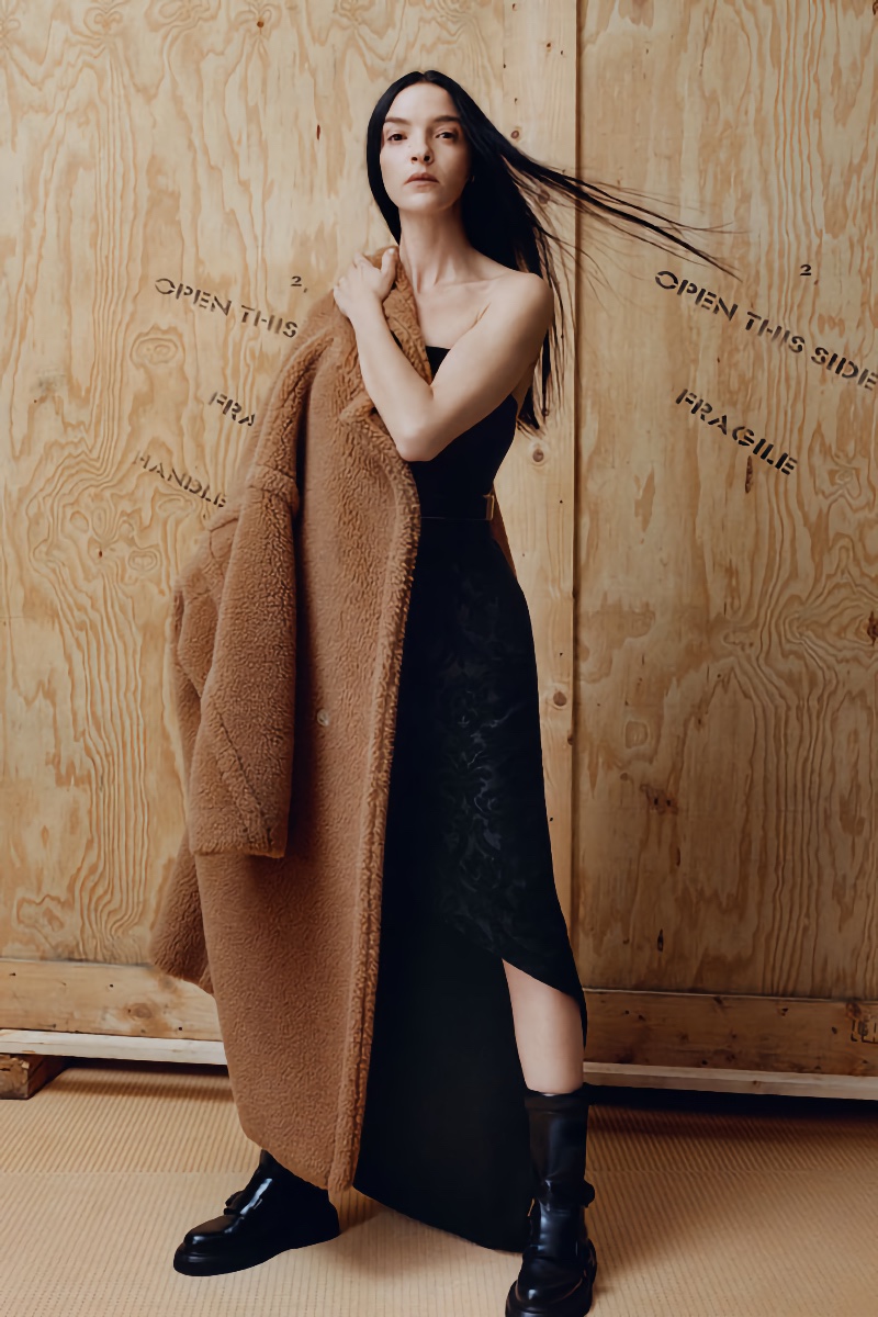 Max Mara pairs the iconic Teddy coat with a black dress.