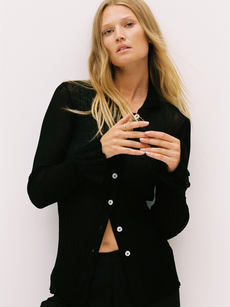 Modeling a cardigan sweater, Toni Garrn poses in her About You collection for fall.