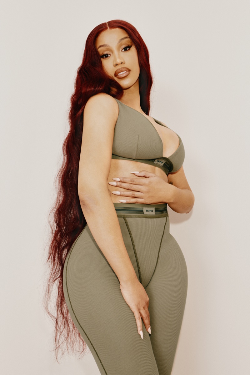 With Rapunzel-length auburn waves, Cardi B brings a fiery touch to SKIMS' new campaign.