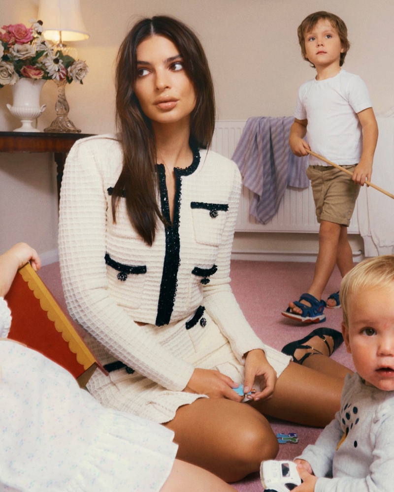 As a stylish mother, Emily Ratajkowski shows off a textured knit jacket and skirt look.