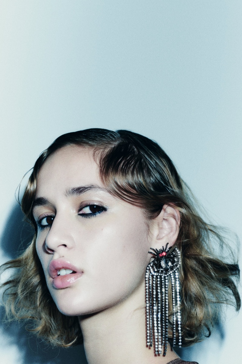 Quinn Mora wears spider rhinestone earrings from Zara.