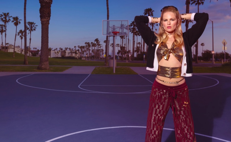 Anna Ewers hits the basketball court in Chanel's cruise 2024 campaign.