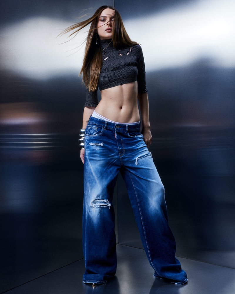 Singer Charlotte Lawrence poses with a crop top and baggy jeans from DSquared2.