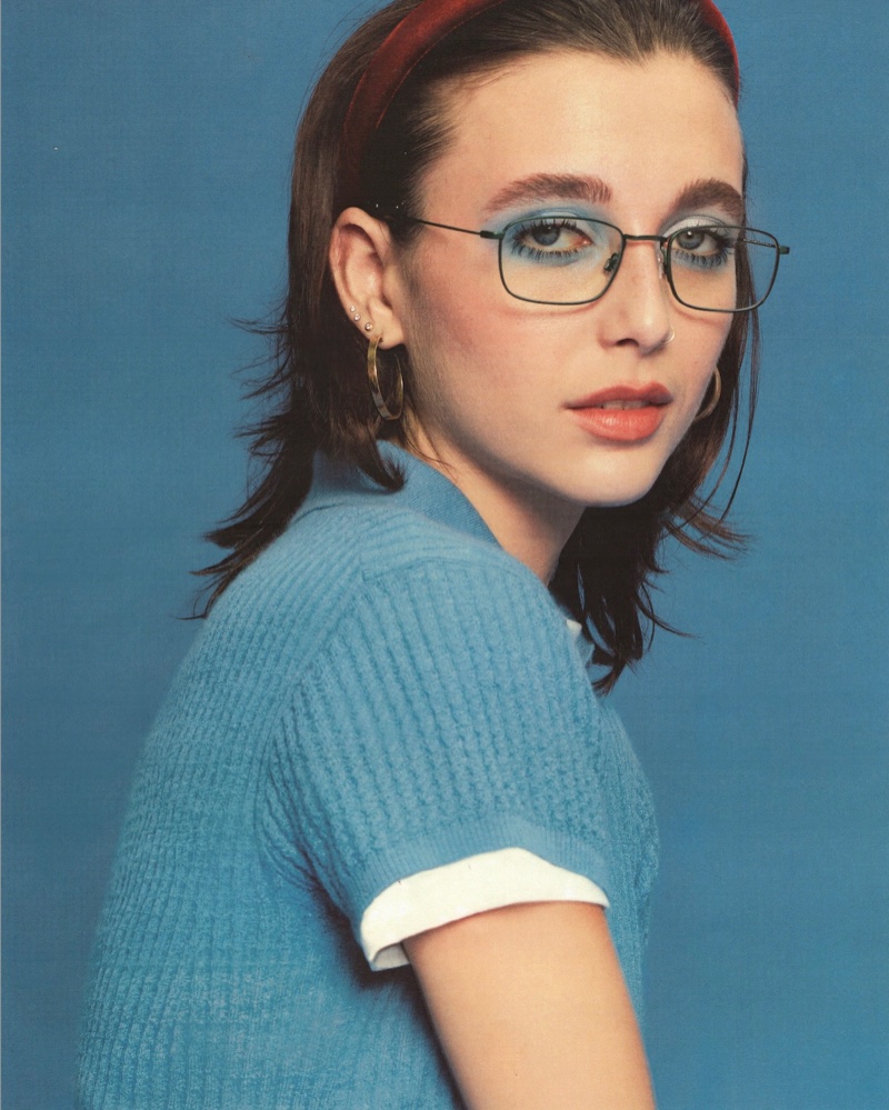 Looking casual chic, Emma Chamberlin wears her Warby Parker Braswell glasses with a velvet headband.