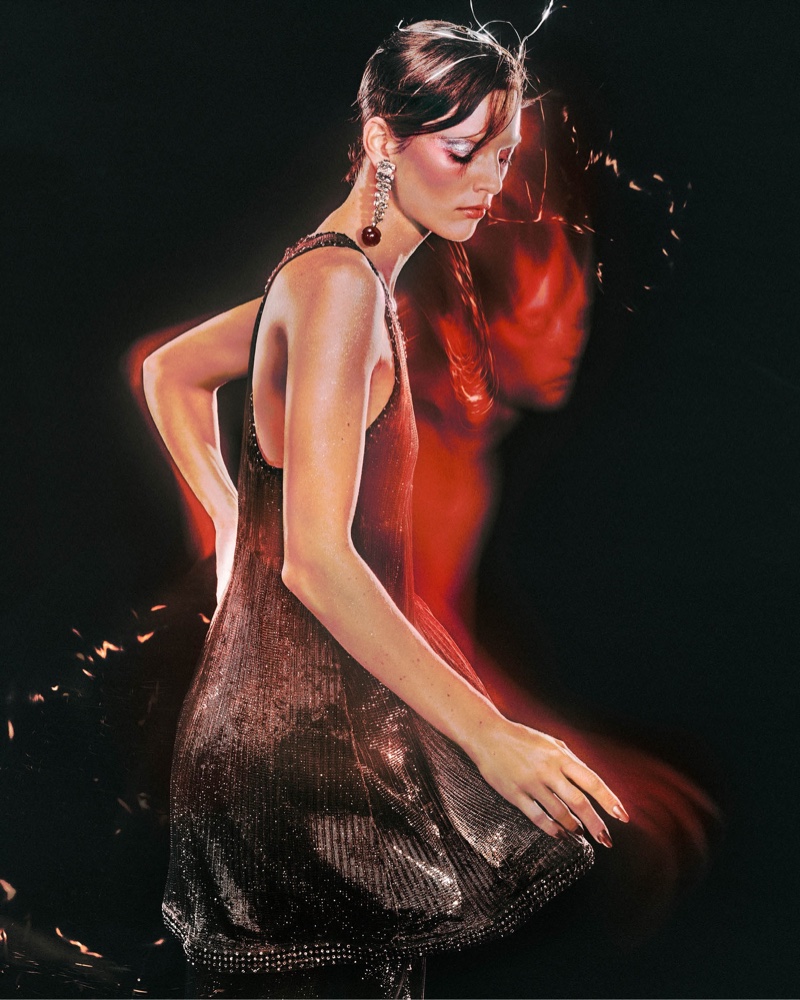 Giorgio Armani features the soft shimmer of a holiday evening dress.