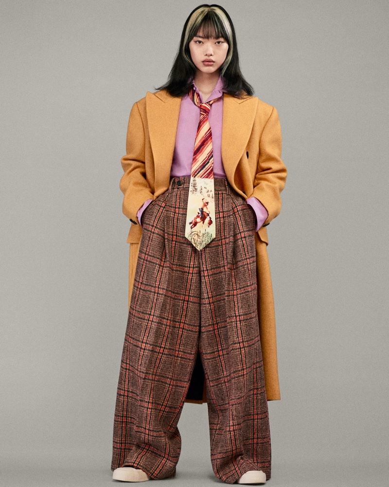 Oversized silhouettes including a long coat, plaid pants, and printed tie stand out in Zara and Harry Lambert's fashion collaboration.