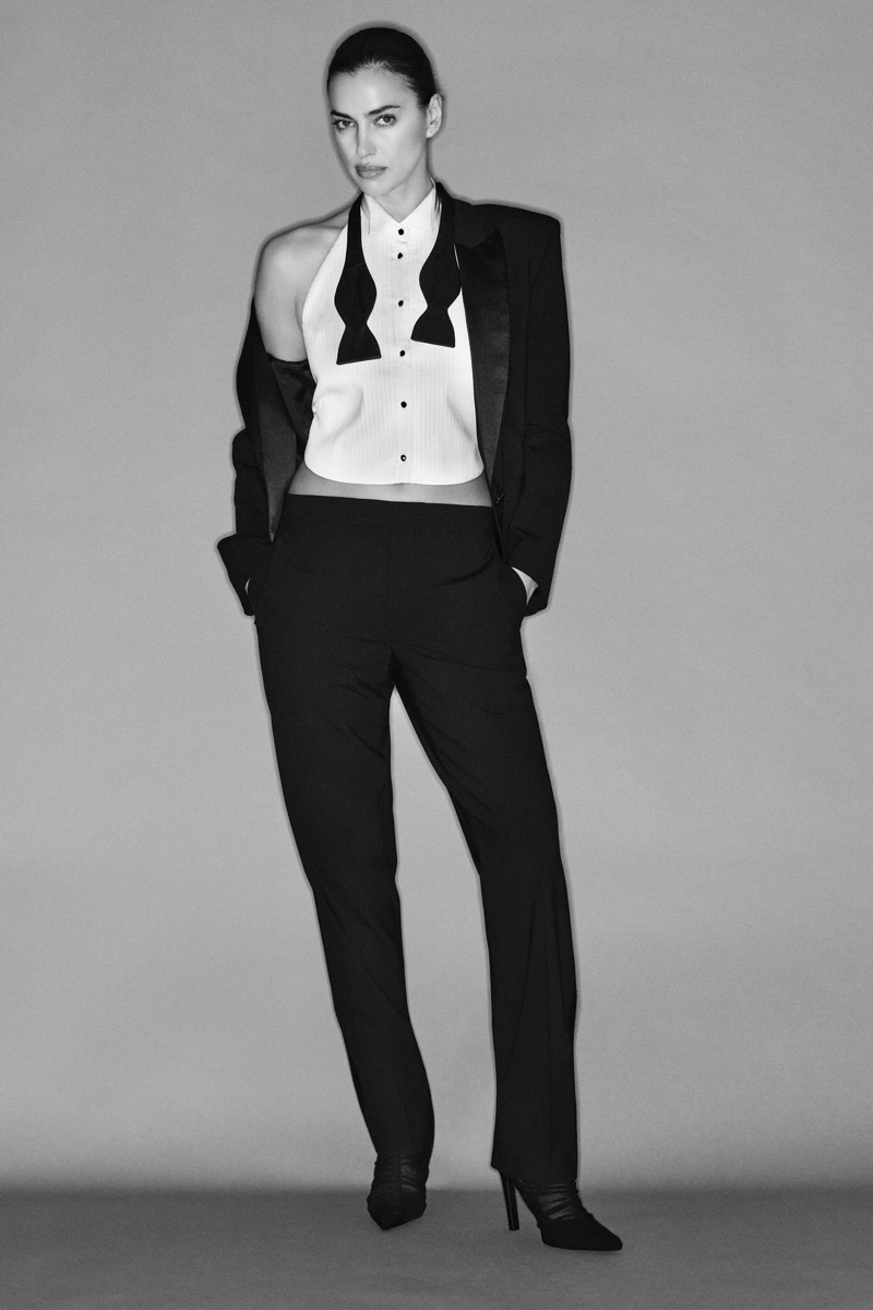 Zara's bold tuxedo twist: sleeveless white shirt and classic black trousers.