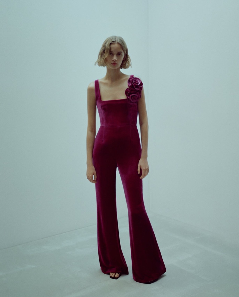 Quinn Mora models flared velour jumpsuit from Mango's capsule collection.