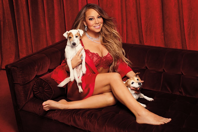 Mariah Carey exudes elegance in a red Victoria's Secret lingerie, sharing a cozy moment with her adorable canine companions.