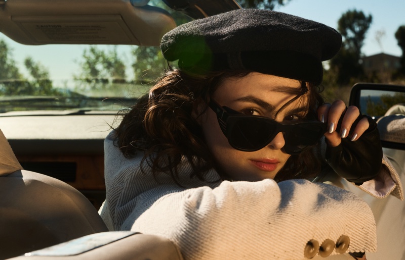 Micaela Wittman exudes a classic allure in a beret and oversized sunglasses.