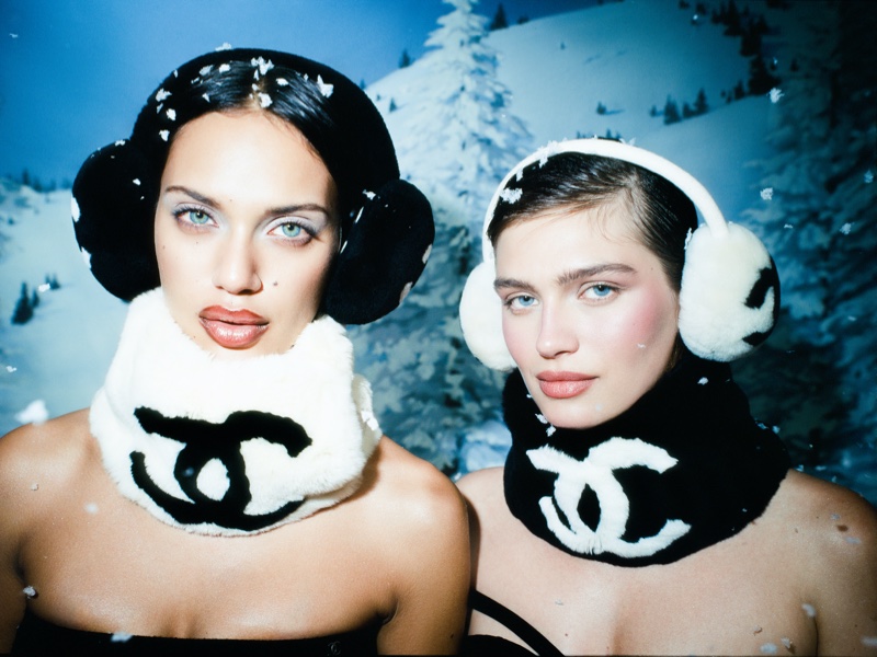 Clad in Chanel accessories, models pose against a winter wonderland for the What Goes Around Comes Around holiday 2023 campaign.